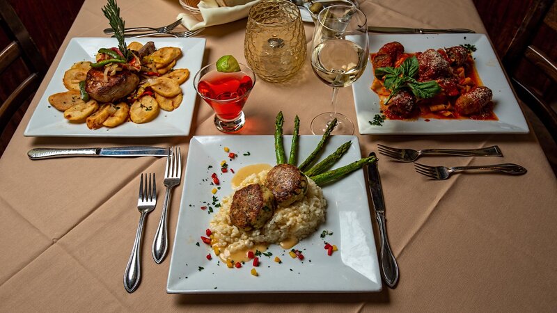 Three entrees with focus on Crab Cake entree