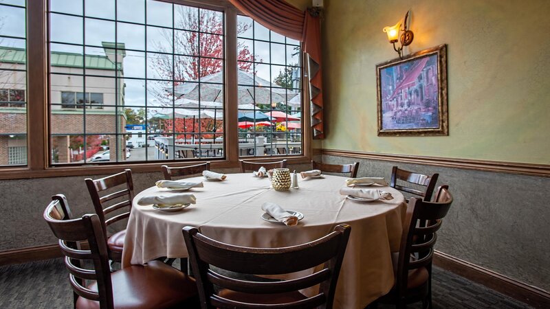 Catering room with set table with seating for eight